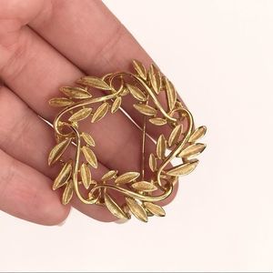 Antique gold tone brooch